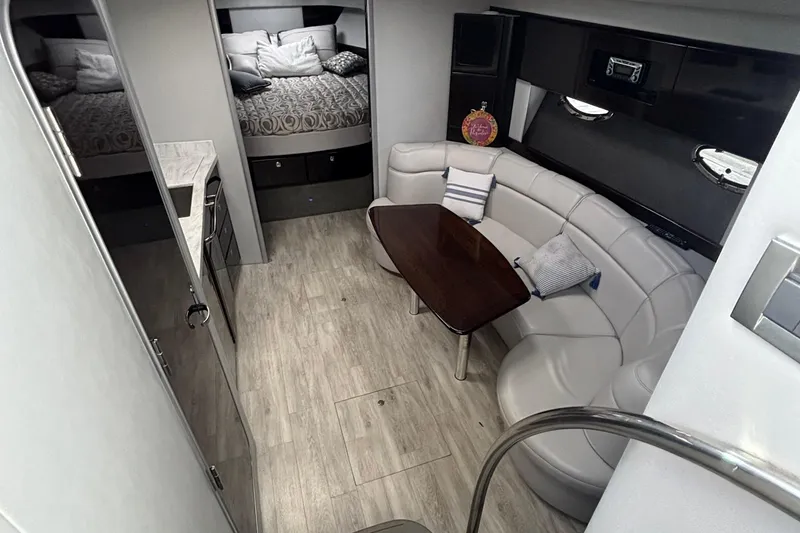 Slide: The Image of 2017 Formula 37 Performance Cruiser with white seating, overlooking calm waters. - 25