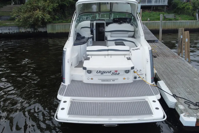 Slide: The Image of 2017 Formula 37 Performance Cruiser on calm water, showcasing sleek design and spacious deck. - 3