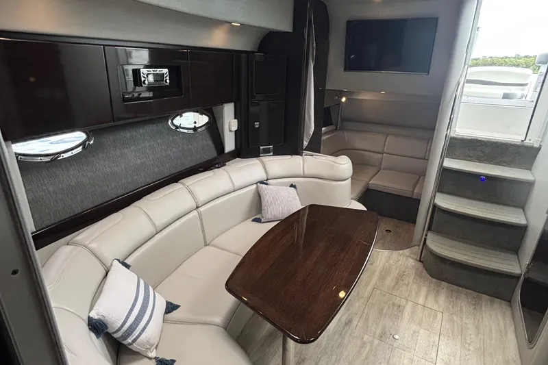 Slide: The Image of 2017 Formula 37 Performance Cruiser interior with white seating and modern dashboard. - 30