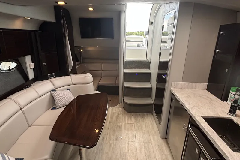 Slide: The Image of 2017 Formula 37 Performance Cruiser interior with white seating and cup holders. - 31