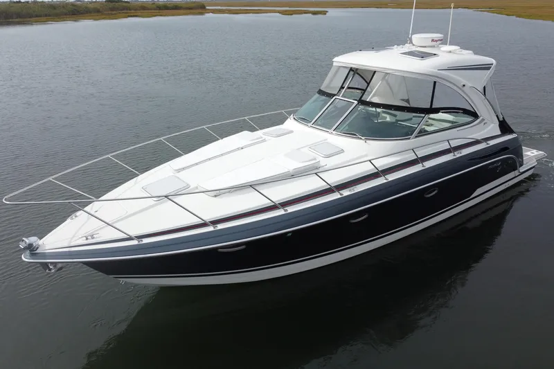 Slide: The Image of 2017 Formula 37 Performance Cruiser on calm water, showcasing sleek design and luxury features. - 5