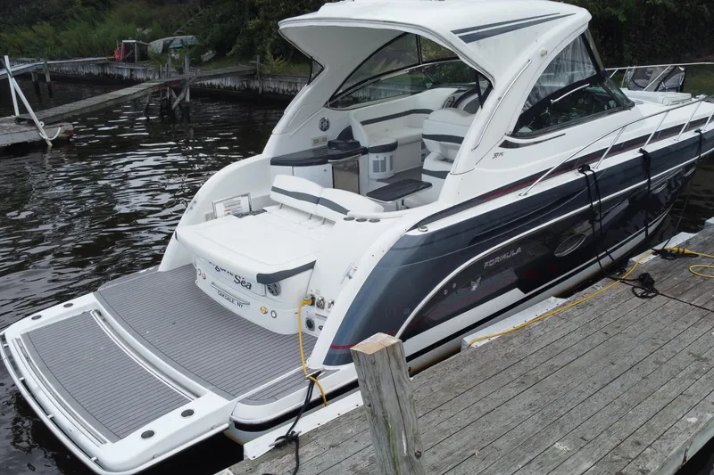 Slide: The Image of 2017 Formula 37 Performance Cruiser on calm water, showcasing sleek design and luxury features. - 8