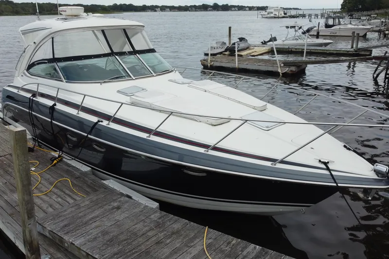 Slide: The Image of 2017 Formula 37 Performance Cruiser on calm water, showcasing sleek design and modern features. - 9