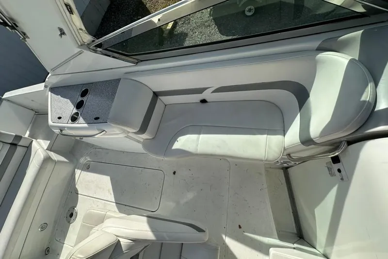 Slide: The Image of 2005 Formula 280 Sun Sport boat interior with white seating and cup holders. - 10