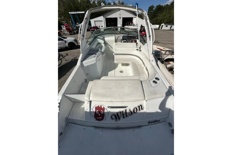 Slide: The Image of 2005 Formula 280 Sun Sport boat with white interior, docked outdoors. - 6