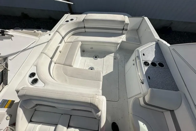 Slide: The Image of 2005 Formula 280 Sun Sport boat interior with white seating and cup holders. - 7