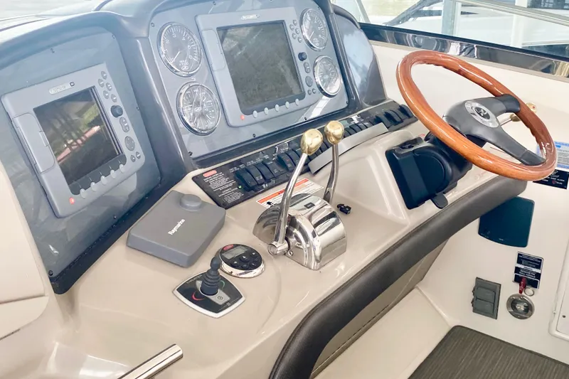 Slide: The Image of 2007 Sea Ray 38 Sundancer helm with dual controls and navigation displays. - 18