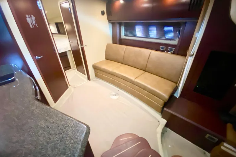 Slide: The Image of 2007 Sea Ray 38 Sundancer interior with leather seating and modern amenities. - 20