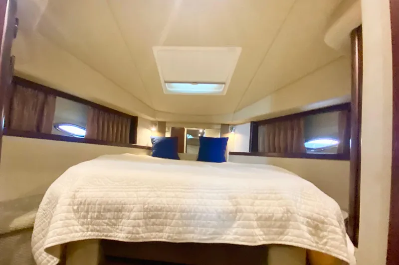 Slide: The Image of Luxurious cabin interior of 2007 Sea Ray 38 Sundancer yacht with cozy bedding. - 26