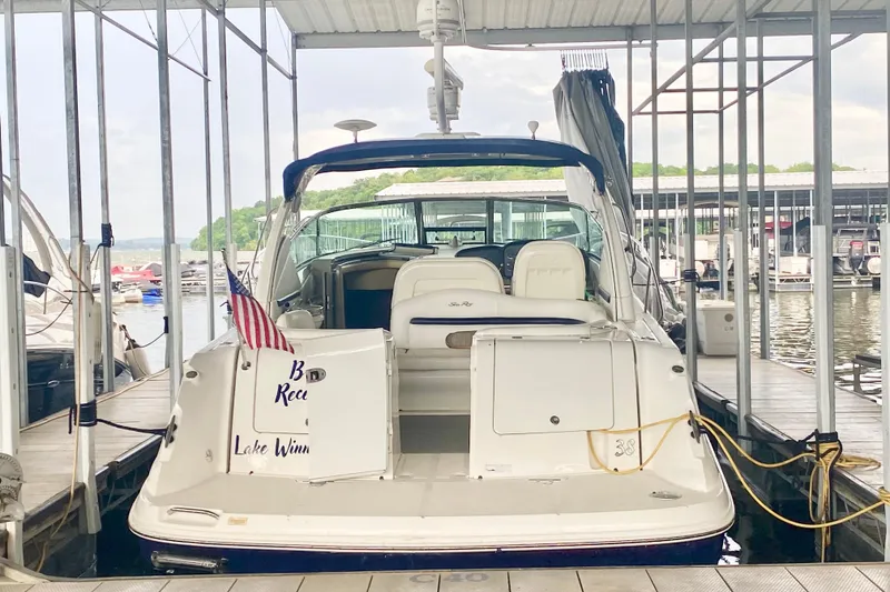 Slide: The Image of 2007 Sea Ray 38 Sundancer docked at marina with American flag. - 8