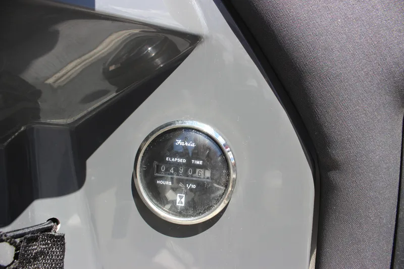 Slide: The Image of Hour meter on 2014 Larson LXi 258 IO boat showing 490.6 hours elapsed. - 16