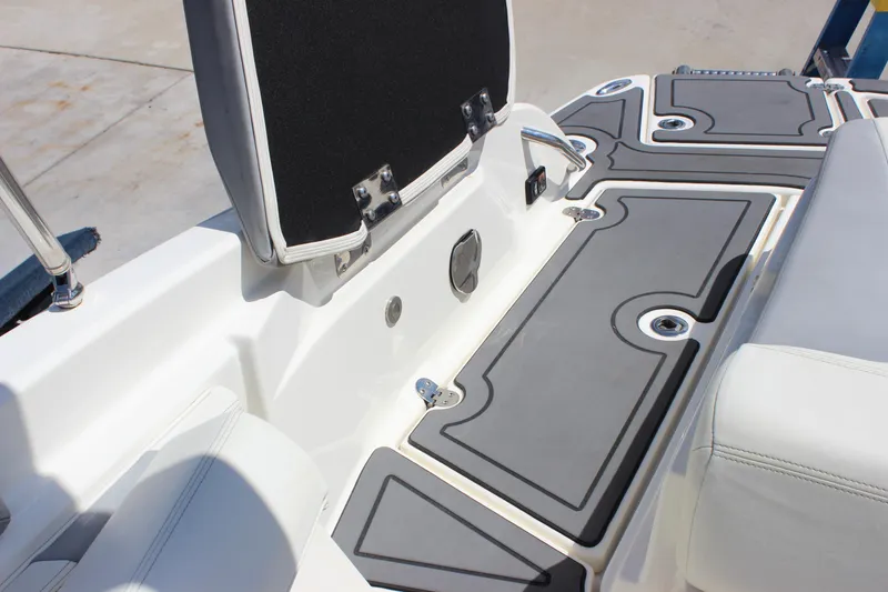 Slide: The Image of 2014 Larson LXi 258 IO boat interior with cushioned seating and sleek design. - 29