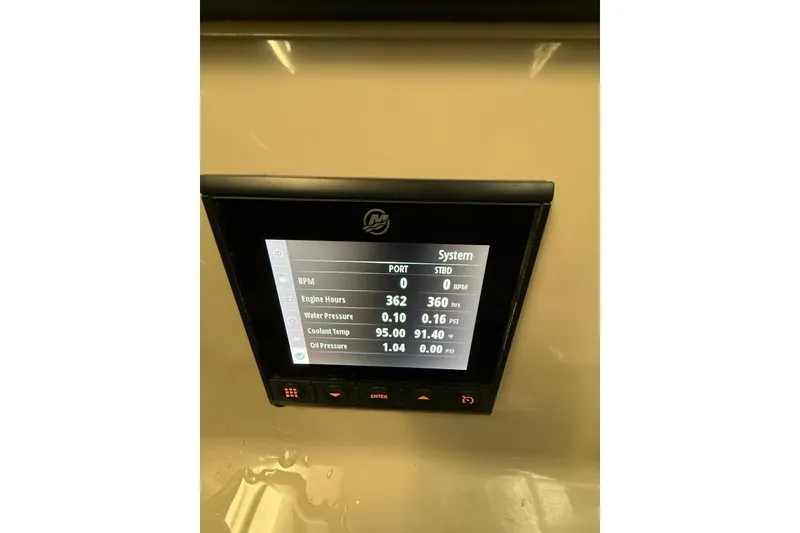 Slide: The Image of Display screen on 2022 Boston Whaler 330 Outrage showing engine metrics. - 6