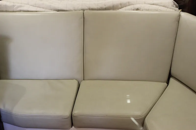 Slide: The Image of Beige leather seating on 2014 Regal 32 Express boat interior. - 17