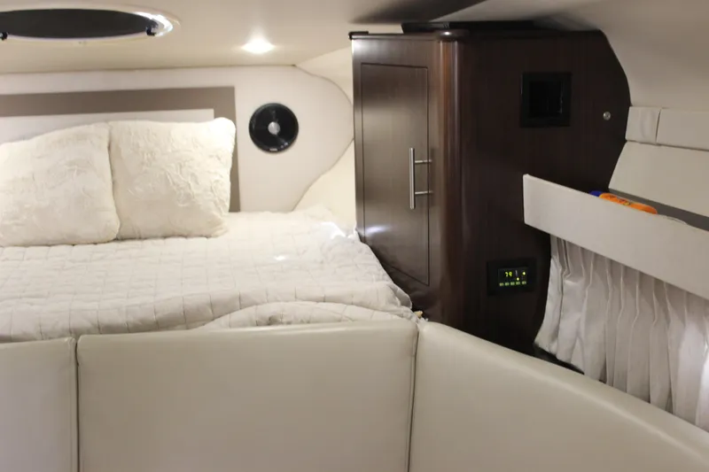 Slide: The Image of Interior cabin of 2014 Regal 32 Express boat with bed and storage. - 18