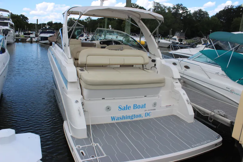 Slide: The Image of 2014 Regal 32 Express boat docked, featuring spacious seating, Washington, DC. - 2