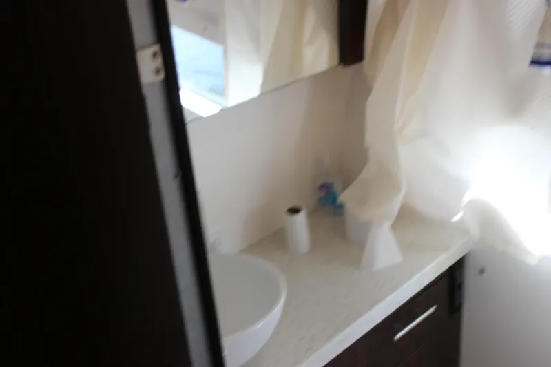 Slide: The Image of Bathroom interior of 2014 Regal 32 Express boat with sink and countertop. - 26