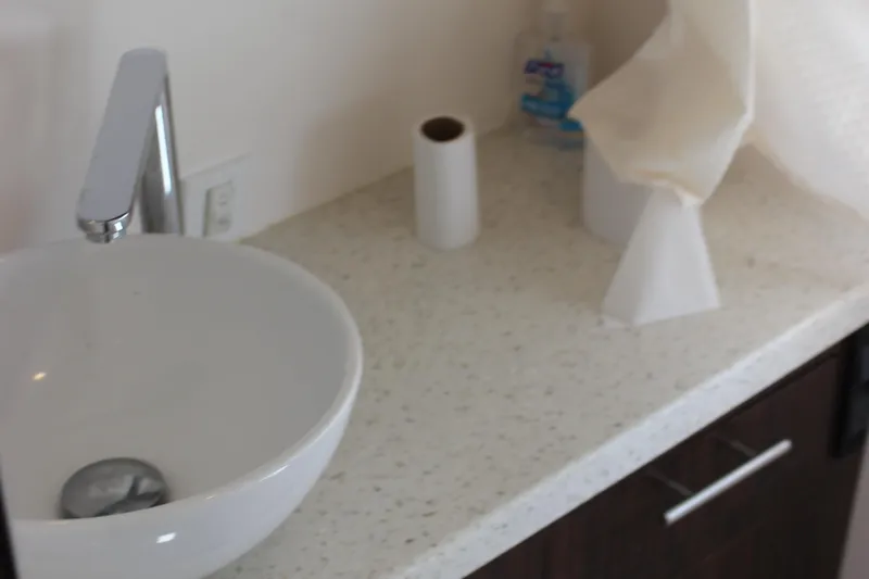 Slide: The Image of Modern bathroom sink on Regal 32 Express 2014 boat with countertop essentials. - 27