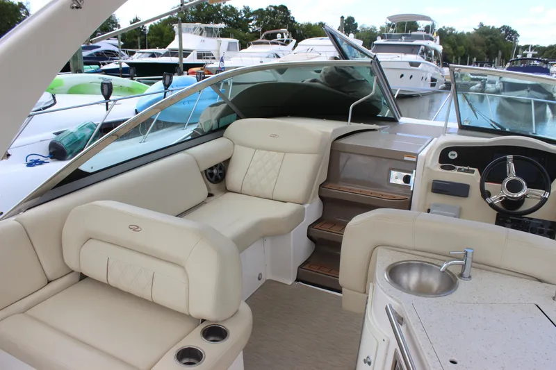 Slide: The Image of Interior of a 2014 Regal 32 Express boat with luxurious seating and helm. - 47