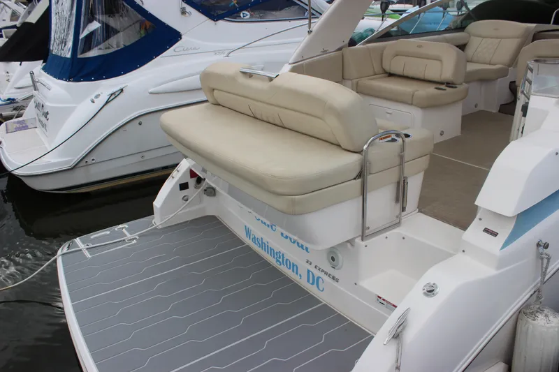 Slide: The Image of 2014 Regal 32 Express boat with beige seating, docked in Washington, D.C. - 49