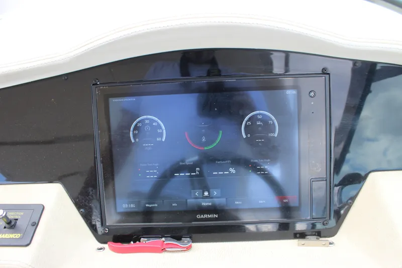 Slide: The Image of Dashboard of 2014 Regal 32 Express boat with Garmin navigation display. - 54