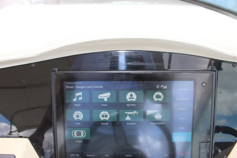Slide: The Image of Dashboard of a 2014 Regal 32 Express boat with touchscreen controls. - 55
