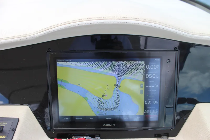 Slide: The Image of Garmin navigation display on 2014 Regal 32 Express boat dashboard. - 56