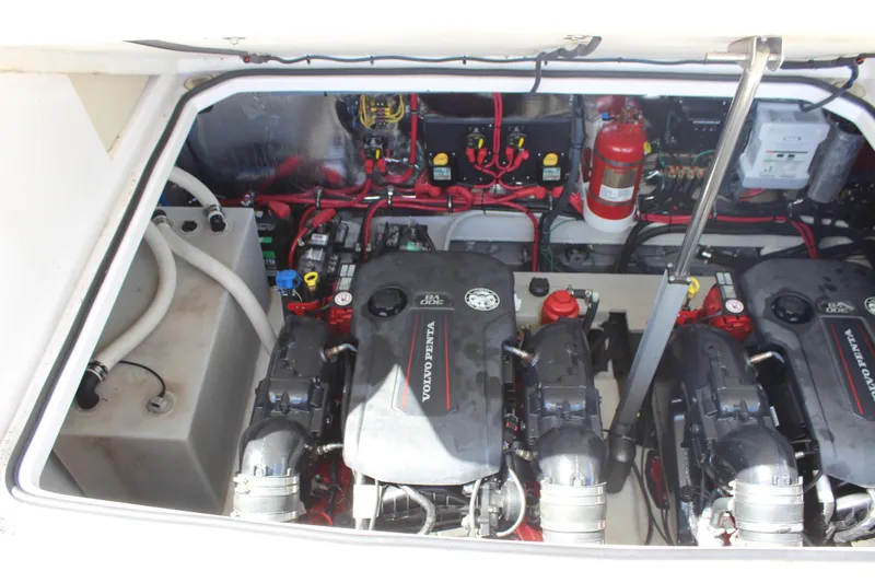 Slide: The Image of Engine compartment of 2014 Regal 32 Express with dual Volvo Penta engines and wiring. - 6