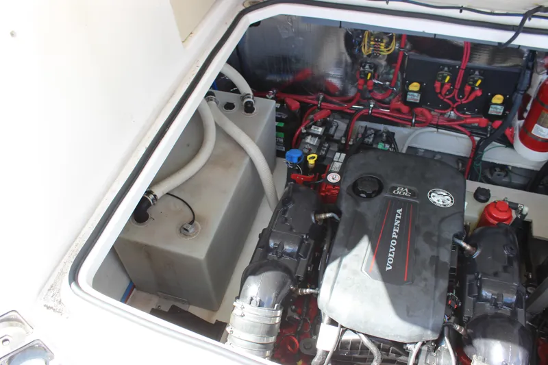 Slide: The Image of 2014 Regal 32 Express engine compartment with Volvo Penta V8 engine and wiring. - 9
