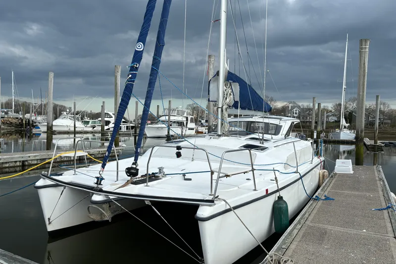 The Image of 2008 Gemini 105Mc catamaran docked at marina under cloudy skies. - 0