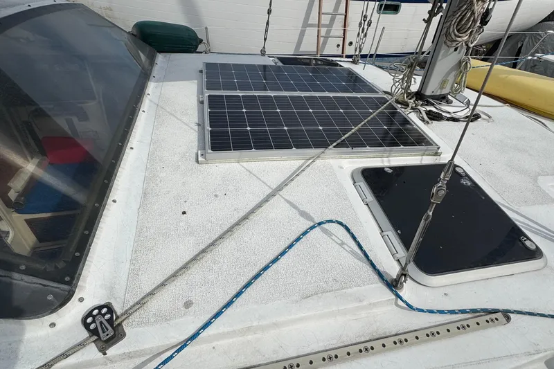 Slide: The Image of 2008 Gemini 105Mc sailboat deck with solar panels and rigging. - 10