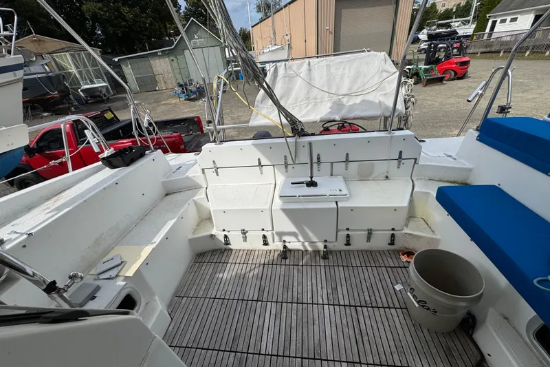 Slide: The Image of 2008 Gemini 105Mc sailboat cockpit with seating, storage, and outdoor equipment. - 11