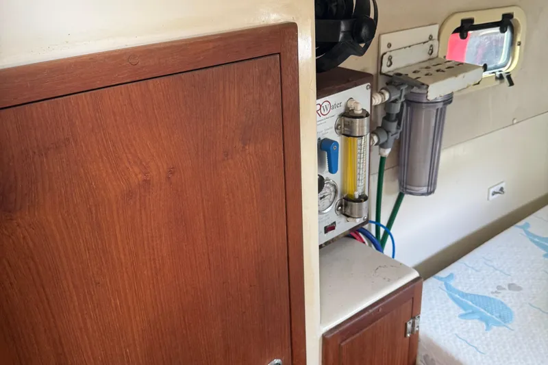 Slide: The Image of Interior of a 2008 Gemini 105Mc boat featuring a water filtration system. - 25