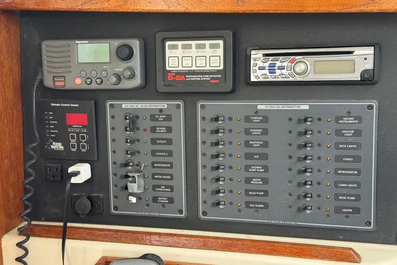 Slide: The Image of Electrical control panel on a 2008 Gemini 105Mc boat, featuring various switches and devices. - 29