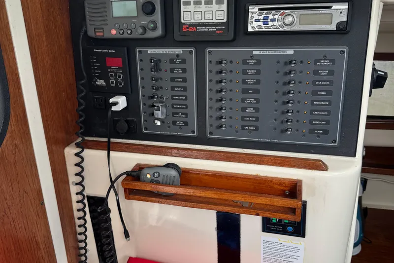 Slide: The Image of Control panel of a 2008 Gemini 105Mc sailboat with various switches and devices. - 30