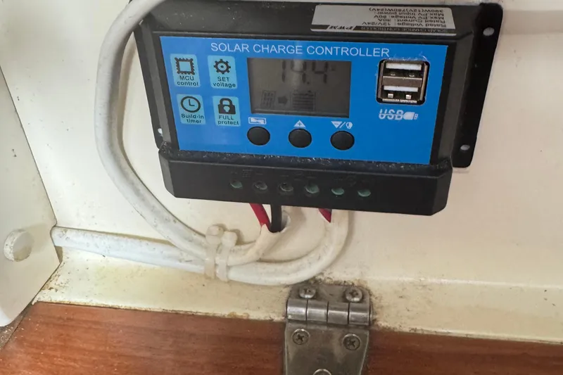 Slide: The Image of Solar charge controller with USB ports on a 2008 Gemini 105Mc boat. - 31
