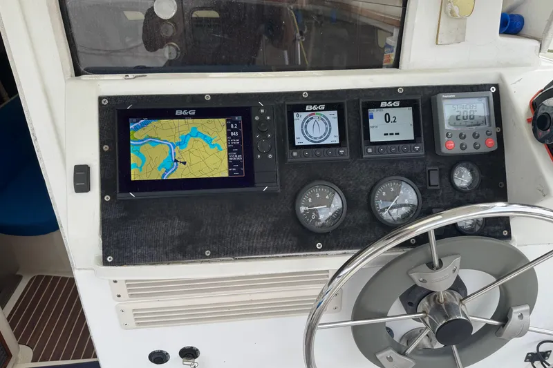 Slide: The Image of Cockpit of 2008 Gemini 105Mc with navigation instruments and steering wheel. - 4