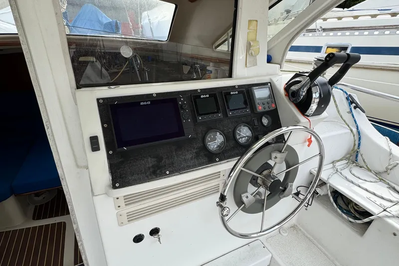Slide: The Image of 2008 Gemini 105Mc cockpit with steering wheel and navigation instruments. - 5