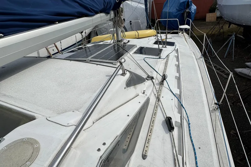 Slide: The Image of 2008 Gemini 105Mc sailboat deck with solar panels and rigging. - 7