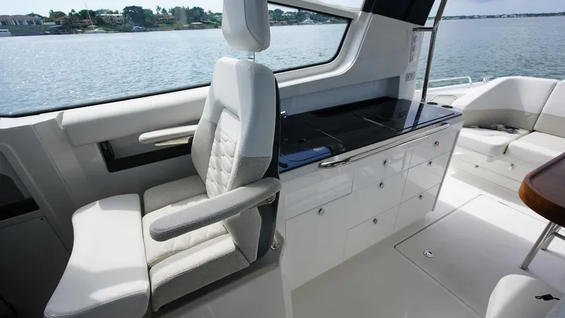 Slide: The Image of Luxurious interior of 2025 Nimbus Weekender 11 #60 yacht with modern seating and cabinetry. - 13