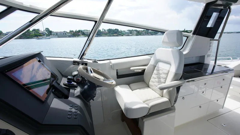 Slide: The Image of Interior of 2025 Nimbus Weekender 11 #60 boat with modern helm and seating. - 14