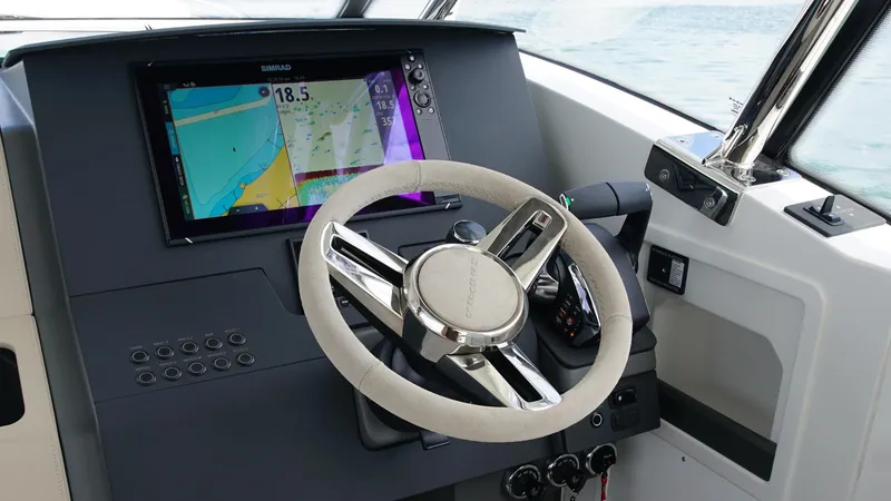 Slide: The Image of Helm of 2025 Nimbus Weekender 11 #60 with navigation display and steering wheel. - 16