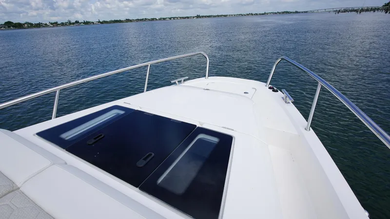 Slide: The Image of Nimbus Weekender 11 #60, 2025 model, cruising on calm waters under a cloudy sky. - 21