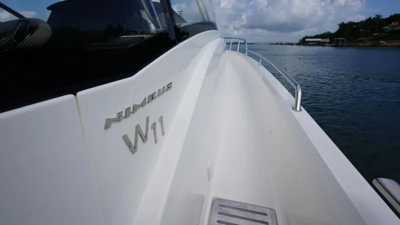 Slide: The Image of Nimbus Weekender 11 #60, 2025 model, sleek design on calm waters. - 24