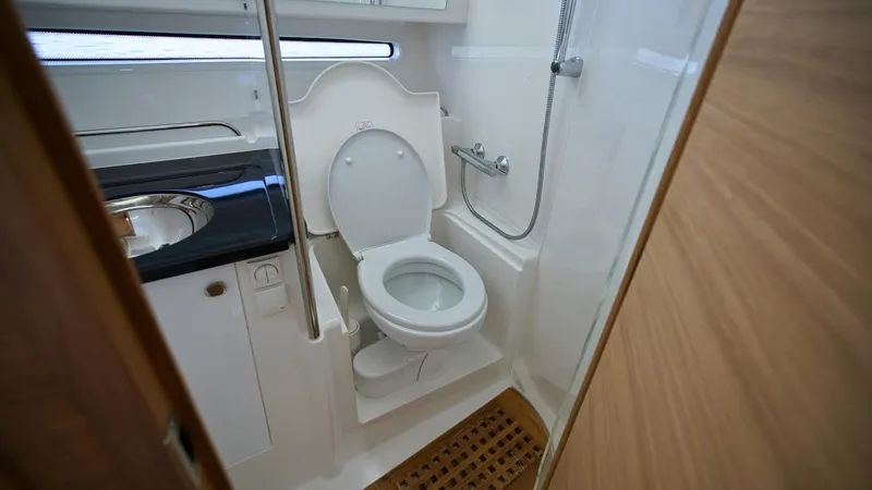 Slide: The Image of Compact bathroom in 2025 Nimbus Weekender 11 #60 boat, featuring toilet and shower. - 28