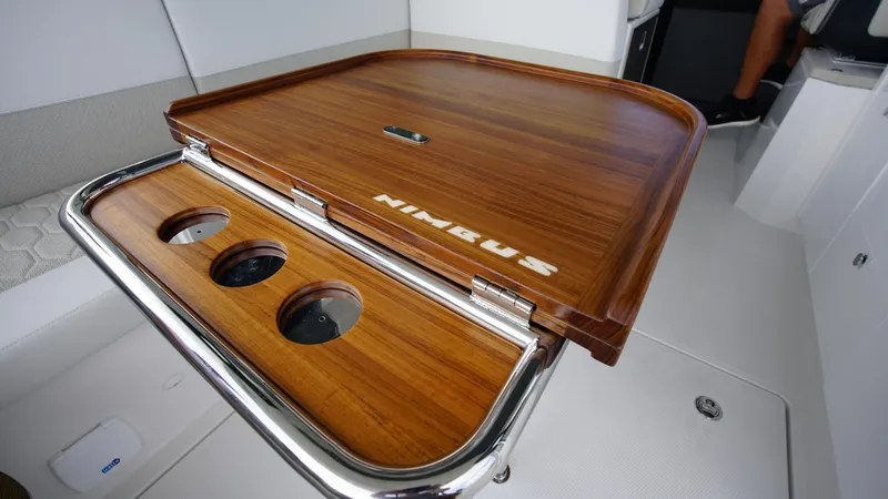 Slide: The Image of Wooden table on Nimbus Weekender 11 #60 boat, 2025 model, with cup holders. - 7