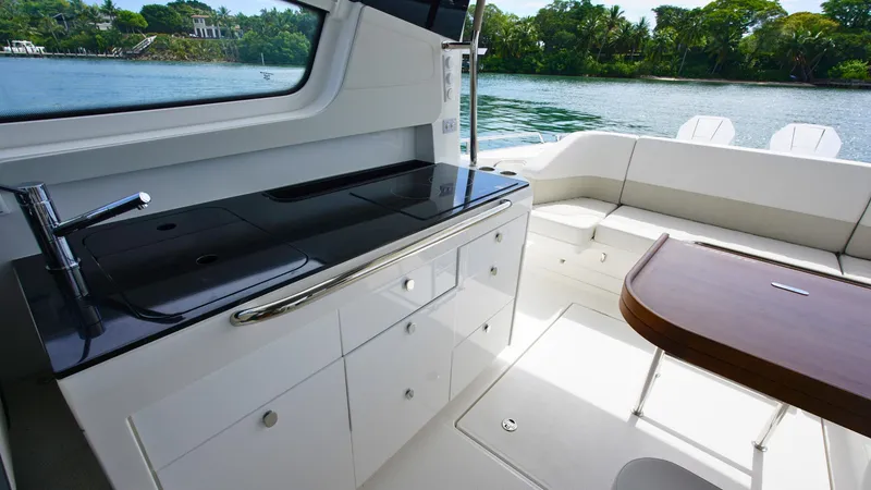 Slide: The Image of Luxurious interior of 2025 Nimbus Weekender 11 yacht with sleek kitchen and seating area. - 15