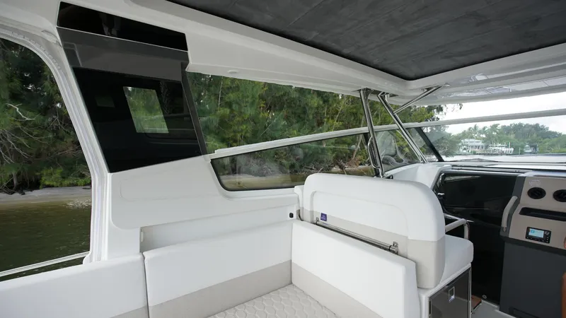 Slide: The Image of Interior of 2025 Nimbus Weekender 11 #60 boat, featuring sleek seating and modern design. - 6