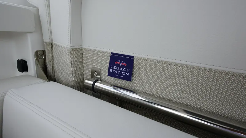 Slide: The Image of Nimbus Weekender 11 Legacy Edition interior detail, featuring sleek white upholstery and metal accents. - 8