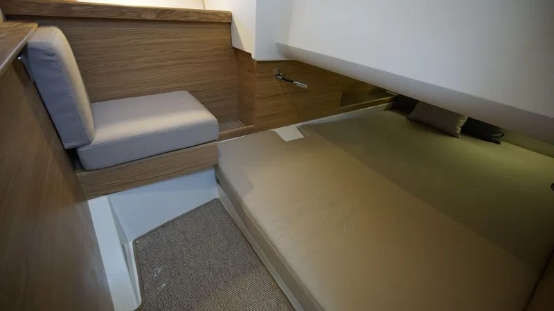 Slide: The Image of 2024 Nimbus Commuter 11 #082 cabin interior with bed and seating area. - 19